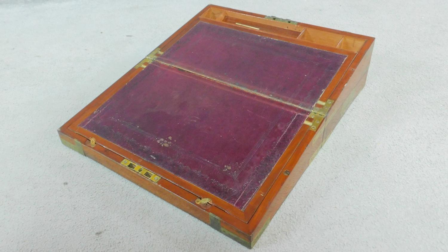 An early 19th century mahogany and brass bound writing slope with inset tooled red leather interior. - Image 3 of 6