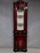 An Italian antique style corner display cabinet with glazed top and floral inlay above frieze drawer