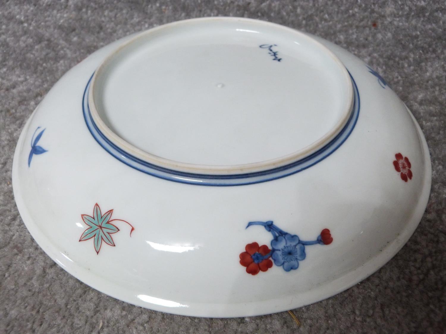 A Meji period Japanese hand painted Nabeshima porcelain plate with floral design along with a Meji - Image 6 of 11