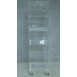 A contemporary perspex display cabinet. H.163 W.42 D.41cm