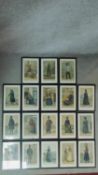 A set of eighteen framed and glazed antique coloured prints depicting clothing fashions from