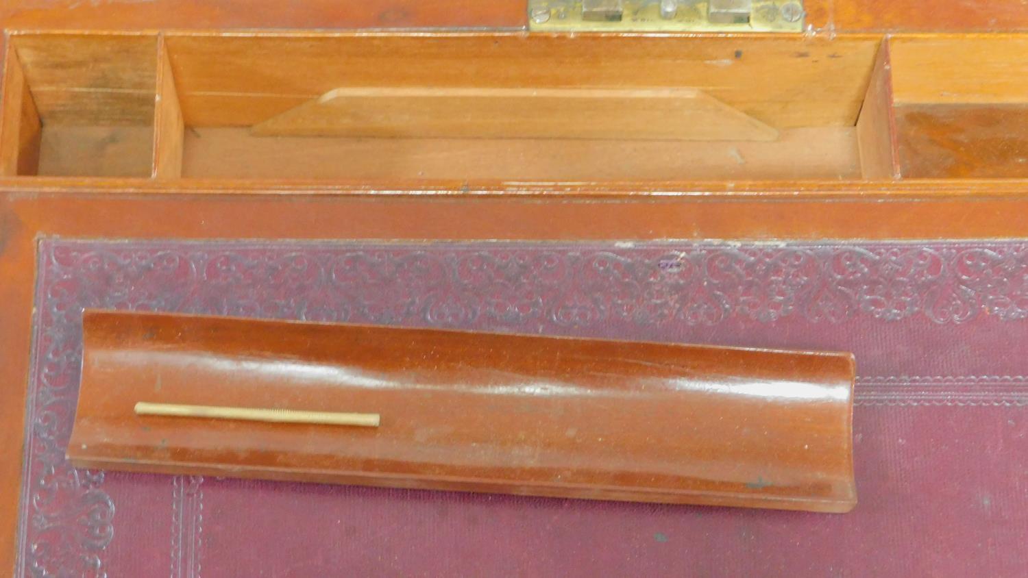 An early 19th century mahogany and brass bound writing slope with inset tooled red leather interior. - Image 5 of 6