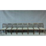 A set of eight Regency style mahogany dining chairs with splat backs on sabre supports. H.85cm