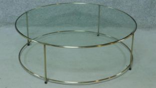 A contemporary metal framed glass topped low coffee table. H.33 W.100 D.100cm