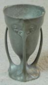 An Art Nouveau Kayserzinn pewter three handled loving cup. Makers stamp to base. H.12cm