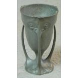 An Art Nouveau Kayserzinn pewter three handled loving cup. Makers stamp to base. H.12cm