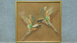 A framed textile of birds in flight. 78x71cm