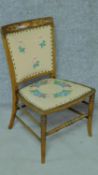 An Edwardian mahogany and satinwood inlaid dining chair with hand embroidered upholstery on turned