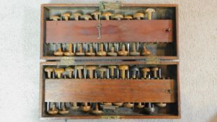 An antique Mahogany locking toolbox fitted with a set of wooden handled precision woodworking and