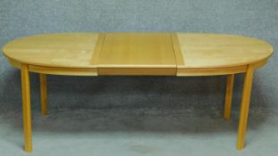 A contemporary birch extending dining table on square legs. (Includes one leaf). H.73 W.207 D.98cm
