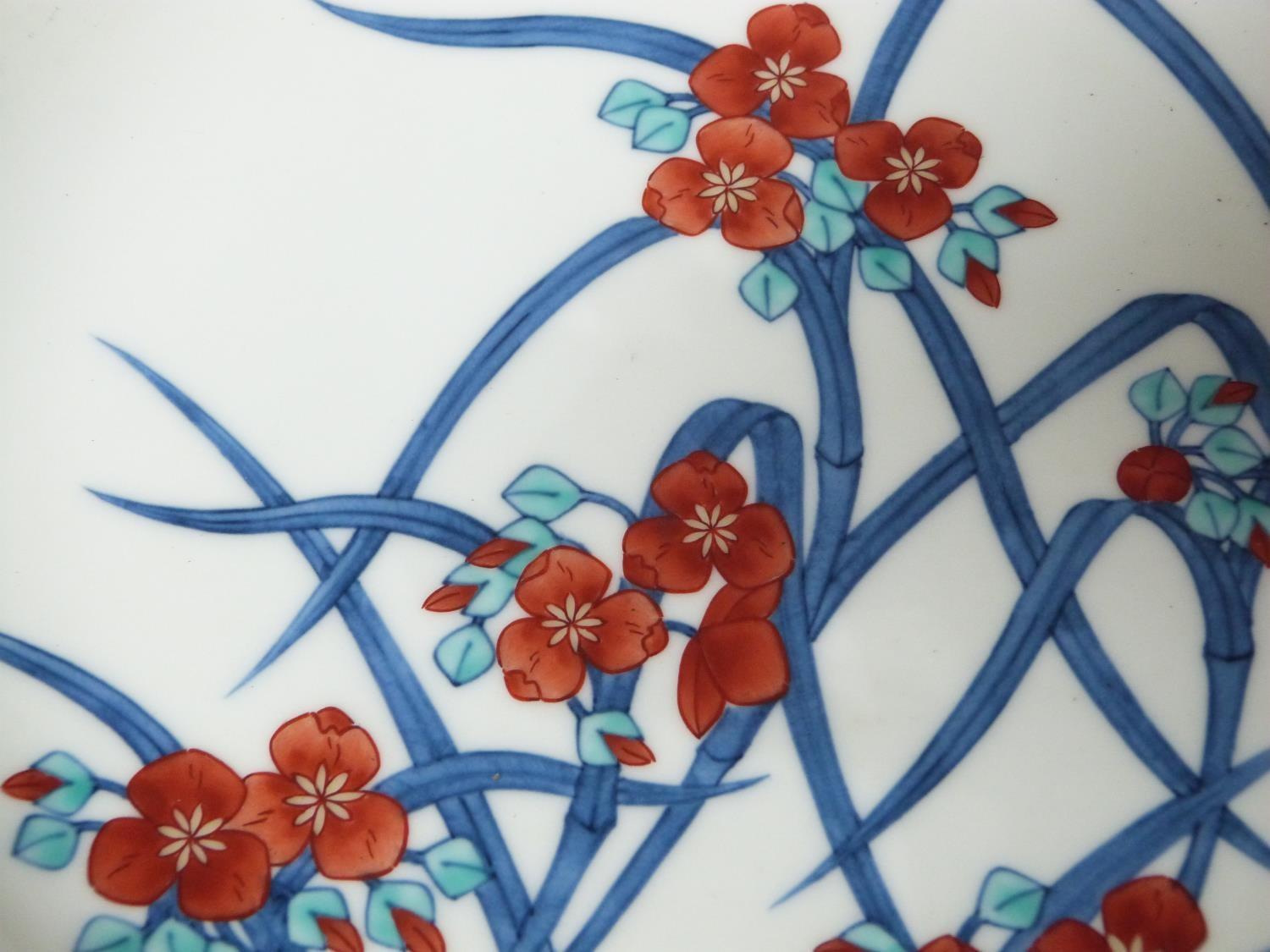 A Meji period Japanese hand painted Nabeshima porcelain plate with floral design along with a Meji - Image 3 of 11