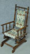 A 19th century American style turned beech child's rocking armchair. H.73cm