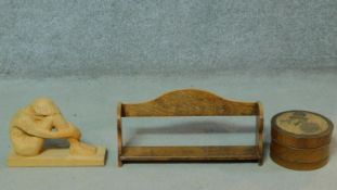 An oak bookshelf together with a carved wooden sewing box with floral design and a carved wooden