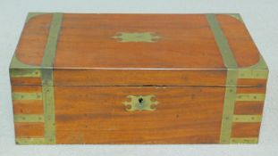 An early 19th century mahogany and brass bound writing slope with inset tooled red leather interior.