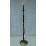 A Chinoiserie ebonised and lacquered floor standing lamp. H.167cm