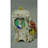 A Victorian hand painted porcelain William Goebel novelty tabacco jar in the form of a lady in a