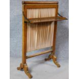 A 19th century bird's eye maple firescreen with folding shelf on cabriole supports. H.88 W.55 D.29cm