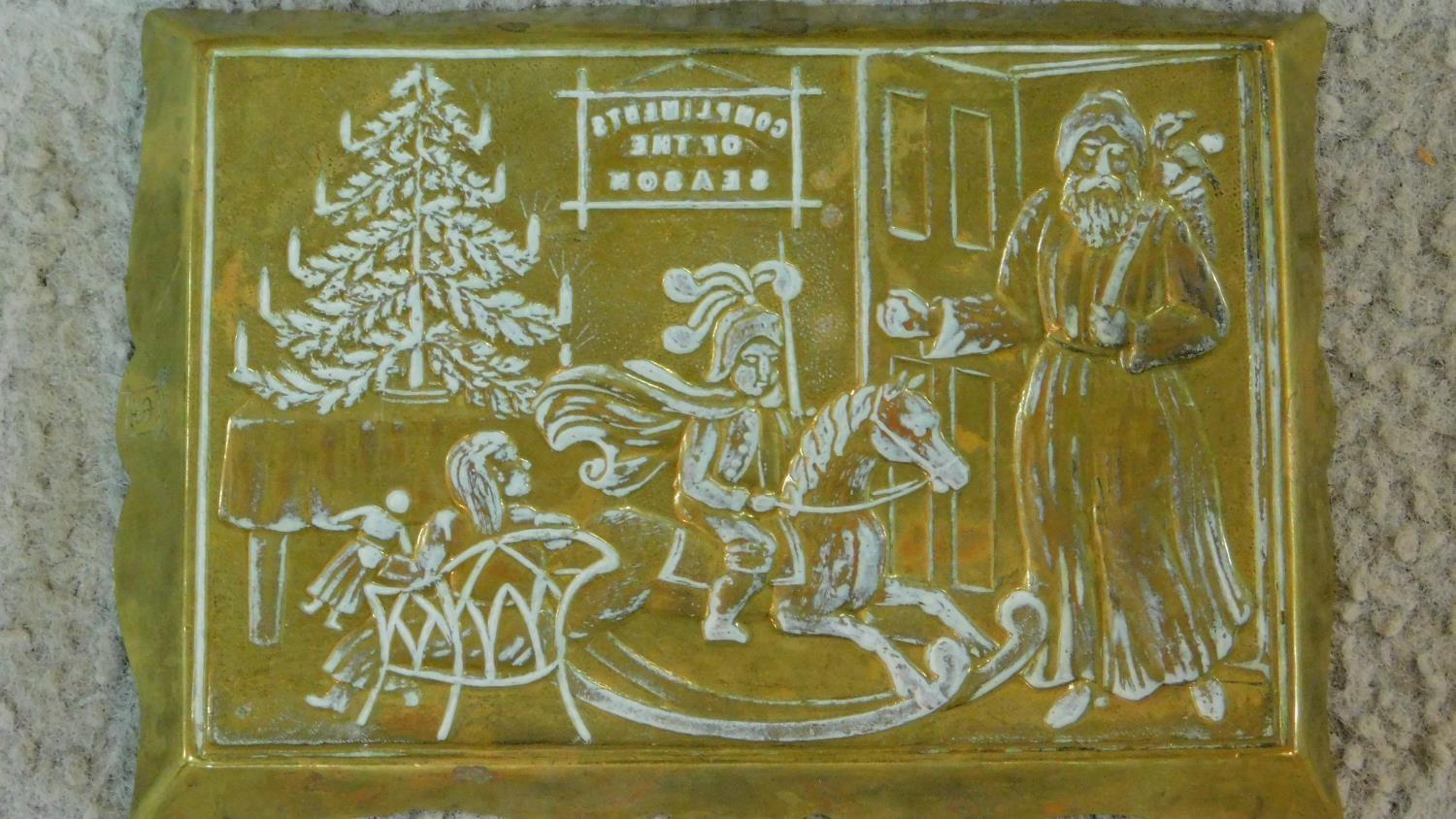 A pair of Victorian Punch and Judy brass door stops along with a repousse brass Christmas scene - Image 5 of 6