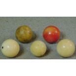 A collection of five Victorian ivory billiard/snooker balls. One dyed red.