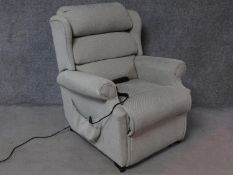 A Leggett & Platt reclining armchair with fully motorised back and footrest. H.103cm