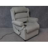 A Leggett & Platt reclining armchair with fully motorised back and footrest. H.103cm