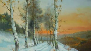 A framed oil on board of silver birches in a wintery scene, signed by Cardil. 76x96cm