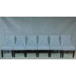 A set of six contemporary dining chairs in powder blue buttoned back upholstery on square