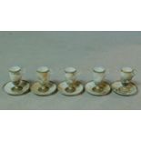 Five antique Japanese egg shell porcelain hand painted tall stemmed cups and saucers. Each one