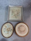 Three framed 19th century embroideries. One silk embroidery of a bunch of flowers, label verso,