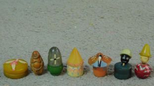 A collection of Art Deco bakelite solid perfume pots and a peach nut netsuke of Budai. One in the