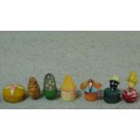 A collection of Art Deco bakelite solid perfume pots and a peach nut netsuke of Budai. One in the