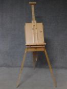 A beech framed fully articulated artist's travelling easel and box. H.56 W.41 D.20cm