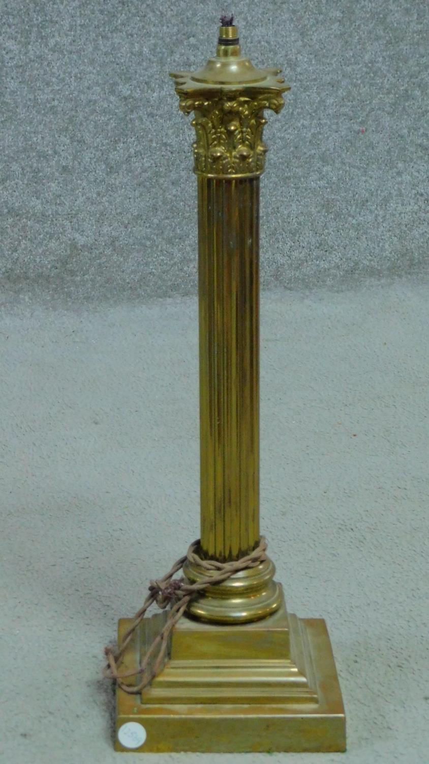 An antique cast brass Corinthian column lamp base. H.50cm