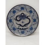 A 20th Japanese blue and white cloisonné enamel bronze footed charger with dragon and flaming