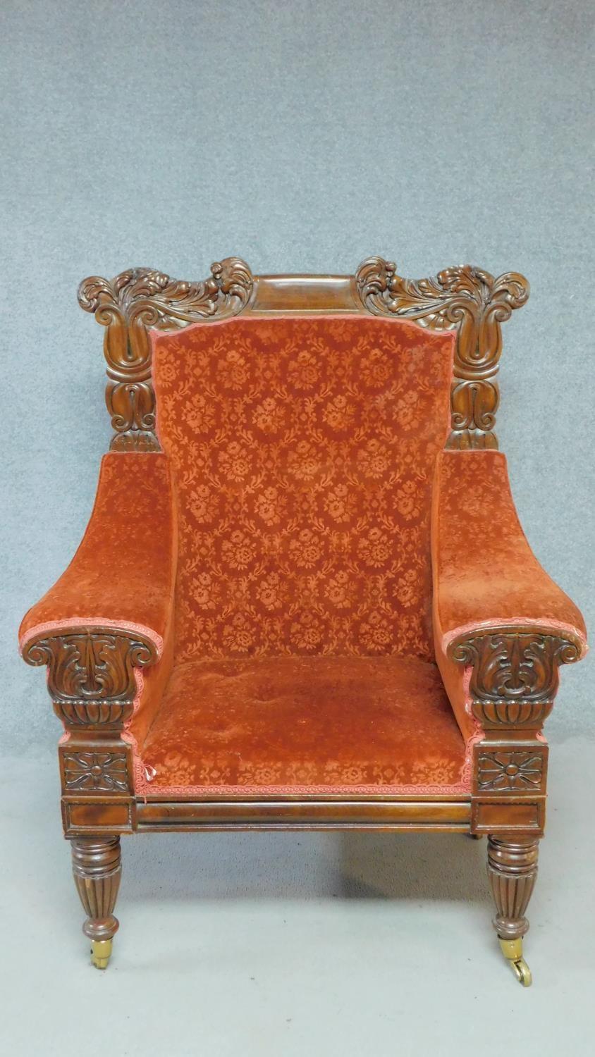 A large Regency mahogany carved throne chair in floral buttoned rouge upholstery on reeded tapering - Image 2 of 8