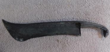 A Chinese bronze ceremonial blade with impressed marks and horse head finial to the handle. W.46cm