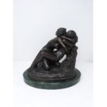 A bronze sculpture after Rodin's 'The Metamorphosis of Ovid' mounted on a green serpentine base.