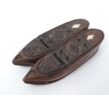 A Georgian carved wooden snuff box in the form of a pair of slippers with engraved geometric and