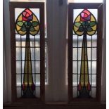 A pair of framed Art Nouveau lead stained glass window panels with abstract floral design. H.90 W.