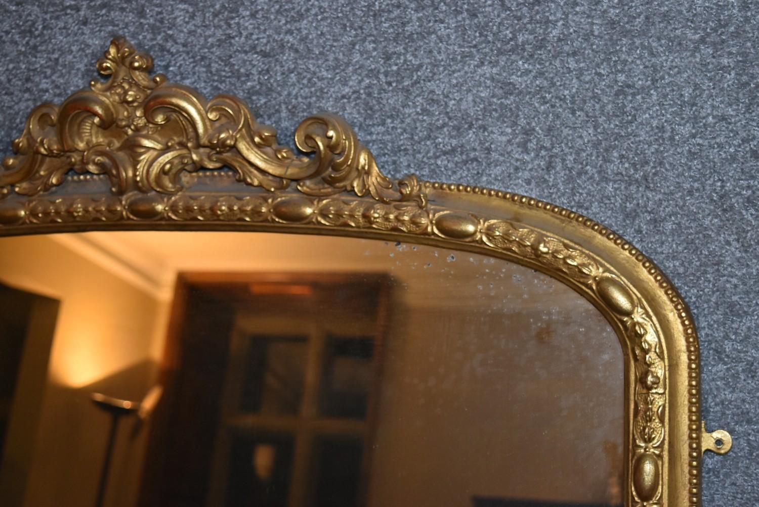 A 19th century carved giltwood overmantel mirror with scrolling foliate cresting above original - Image 5 of 5