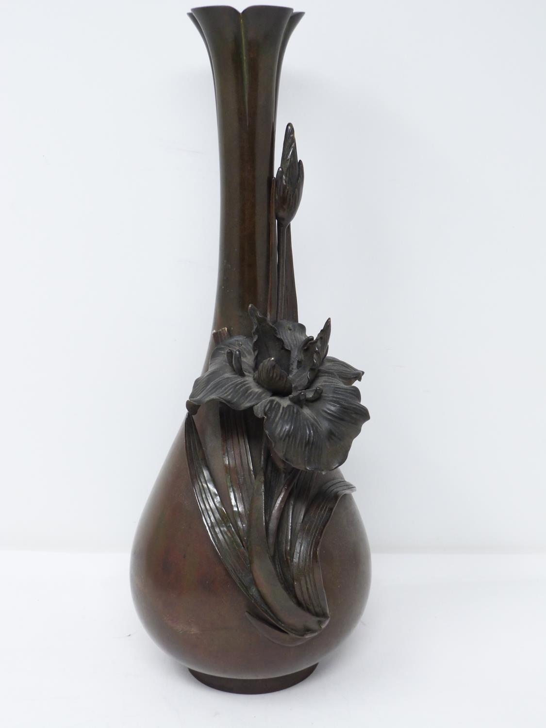 A Japanese Meji period relief bronze Iris vase. Artists signature to base. With sculpted form of