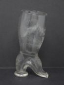 An engraved 19th century glass stirrup cup in the form of a heeled boot, engraved with ferns, ribbon