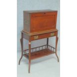A late Victorian mahogany secretaire stationery cabinet on stand with fall front revealing fitted