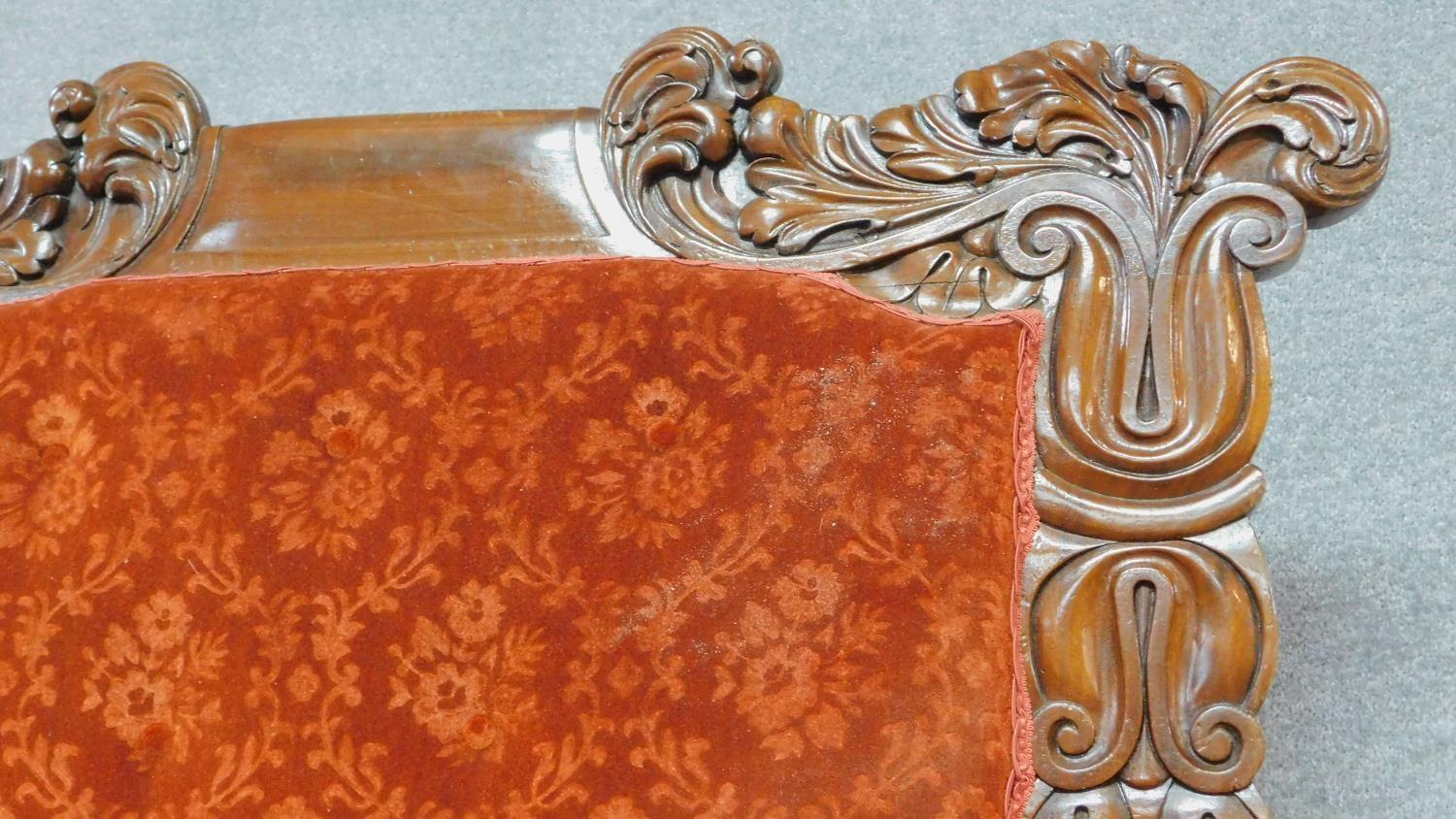 A large Regency mahogany carved throne chair in floral buttoned rouge upholstery on reeded tapering - Image 3 of 8