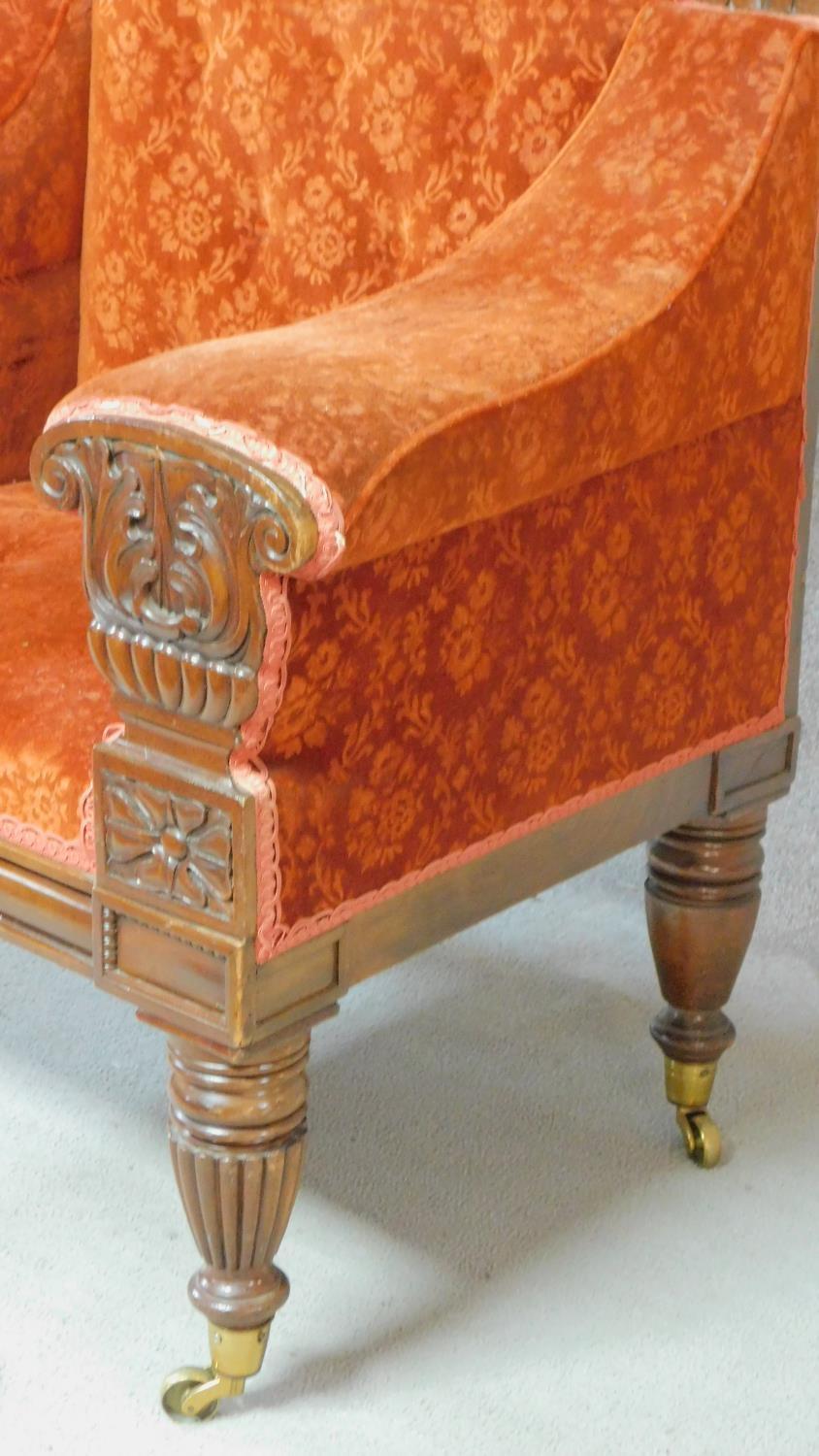 A large Regency mahogany carved throne chair in floral buttoned rouge upholstery on reeded tapering - Image 7 of 8