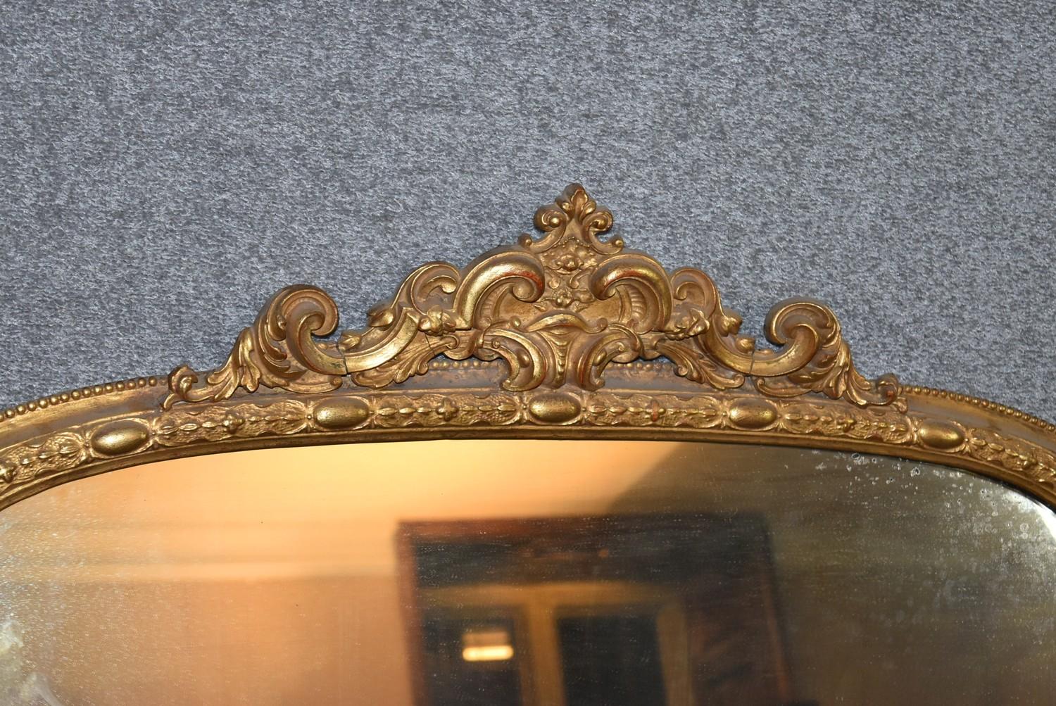A 19th century carved giltwood overmantel mirror with scrolling foliate cresting above original - Image 2 of 5
