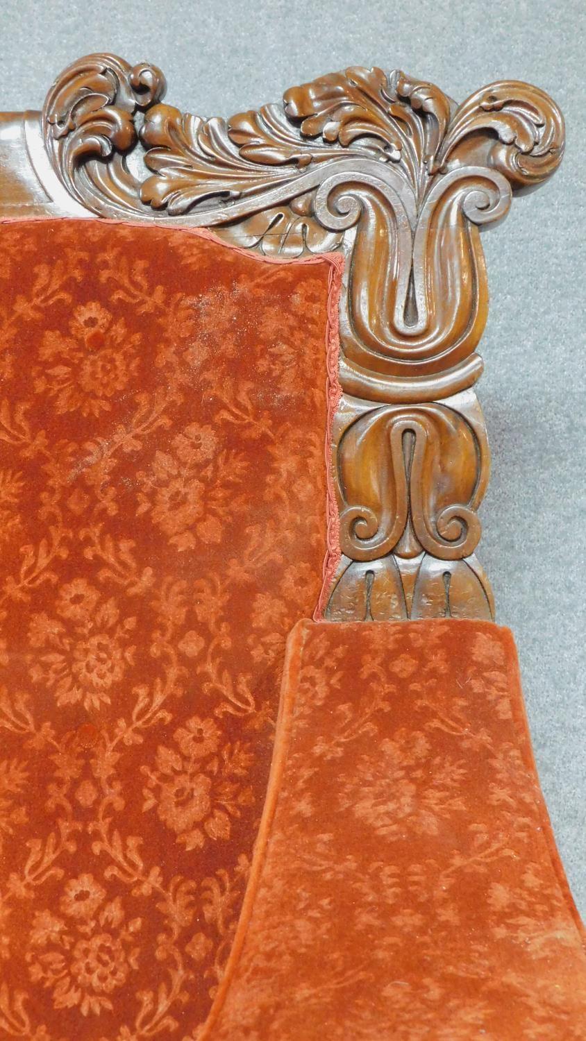 A large Regency mahogany carved throne chair in floral buttoned rouge upholstery on reeded tapering - Image 4 of 8