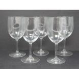 A set of five Baccarat crystal wine glasses. Signed and stamped to foot. H16.5cm