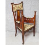 A 19th century Art Nouveau mahogany armchair with floral satinwood inlaid splat and fret cut