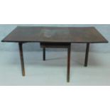 A 19th century mahogany drop leaf dining table on square section supports. H.71 W.150 D.91cm